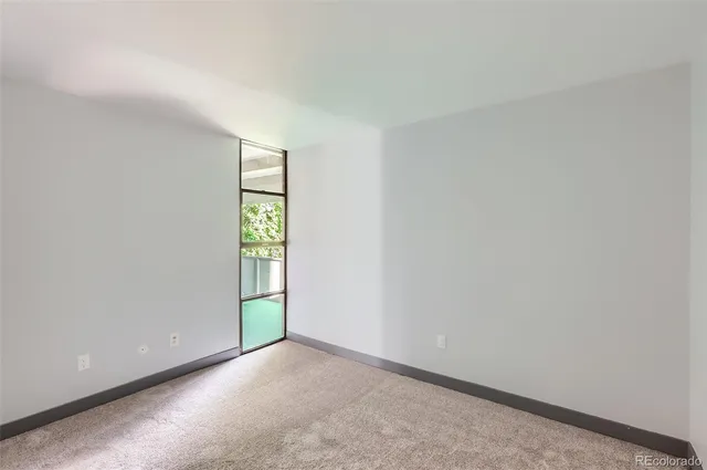 a view of an empty room and window