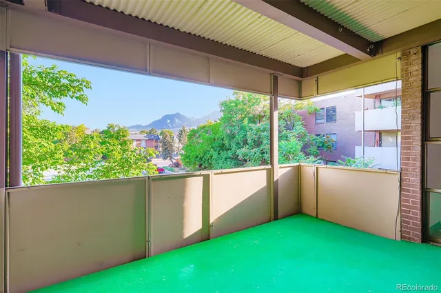 a view of a patio with a table and chairs