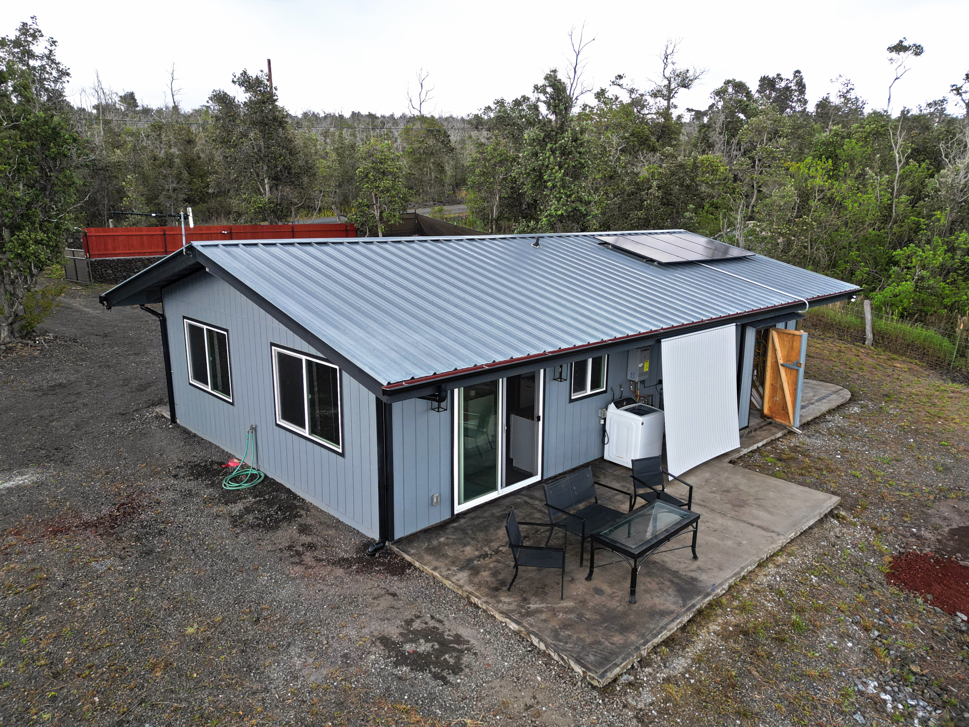 92-1920 Aloha Boulevard Ocean View, HI 96704 - Photo 12 of 26 a aerial view of a house with a yard and sitting space