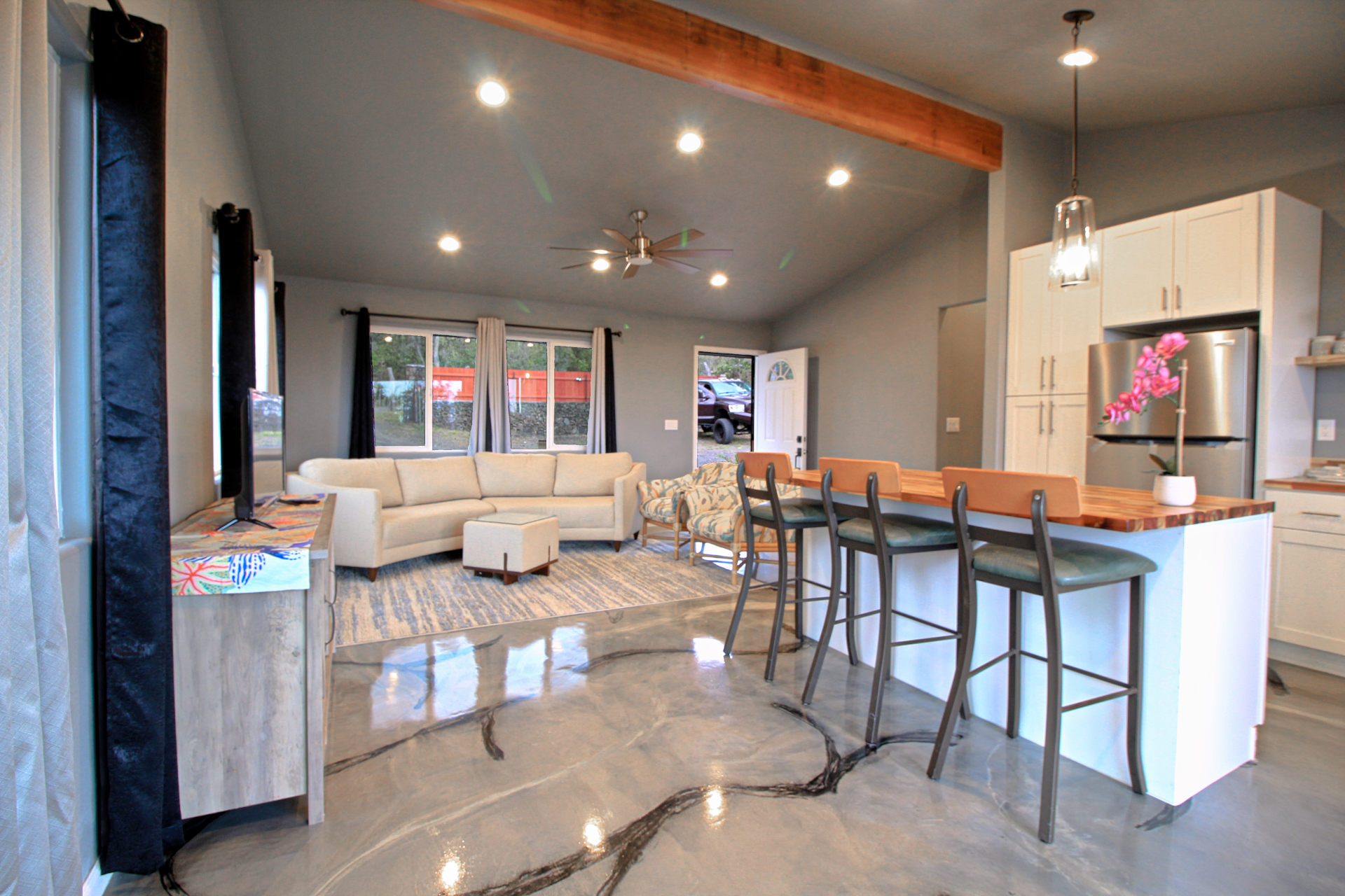 92-1920 Aloha Boulevard Ocean View, HI 96704 - Photo 16 of 26 a living room with furniture kitchen view and a large window