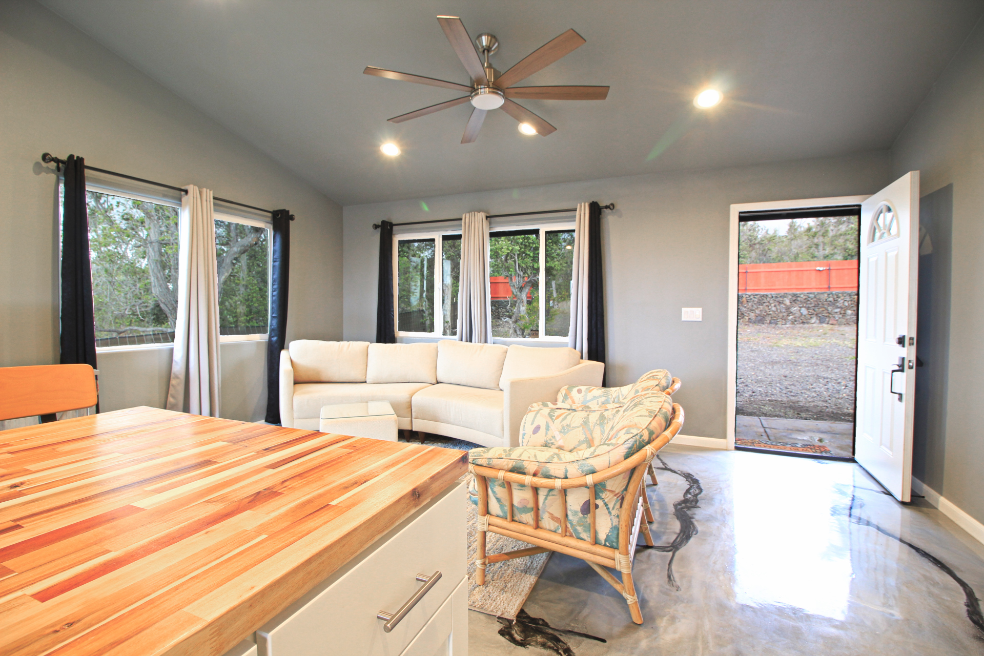 92-1920 Aloha Boulevard Ocean View, HI 96704 - Photo 17 of 26 a living room with furniture and a large window with outer view
