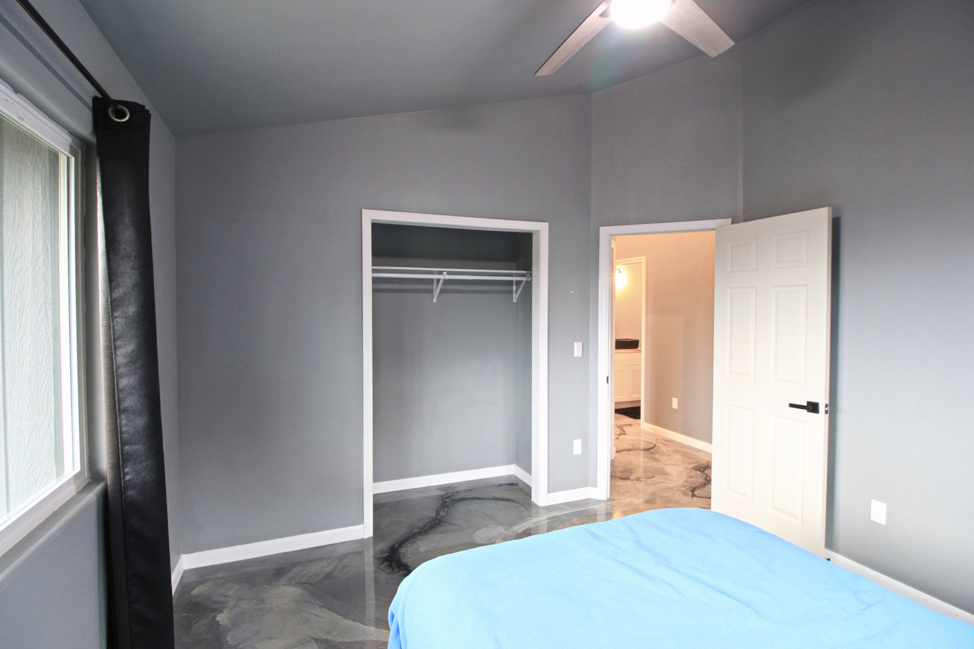 92-1920 Aloha Boulevard Ocean View, HI 96704 - Photo 23 of 26 a bedroom with a bed and hallway