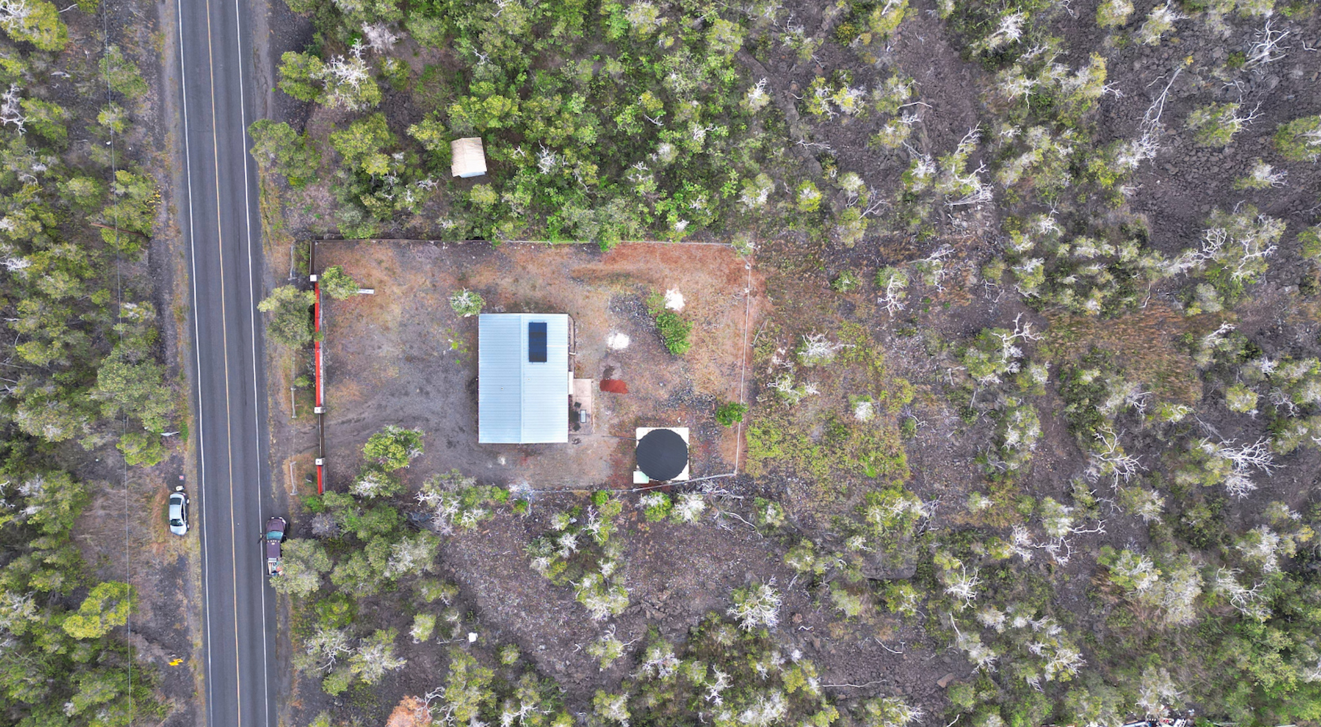 92-1920 Aloha Boulevard Ocean View, HI 96704 - Photo 5 of 26 a backyard of a house with lots of green space and garden view