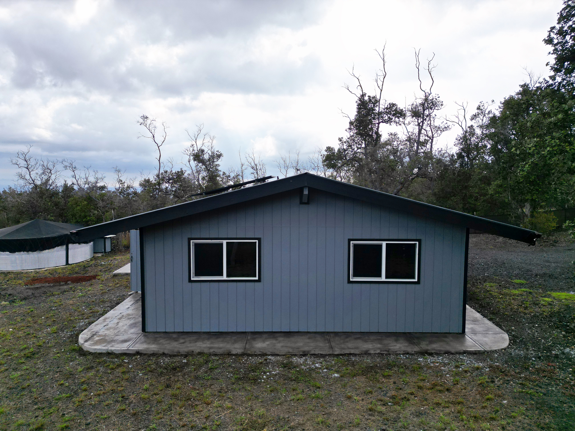 92-1920 Aloha Boulevard Ocean View, HI 96704 - Photo 6 of 26 a house with trees in the background