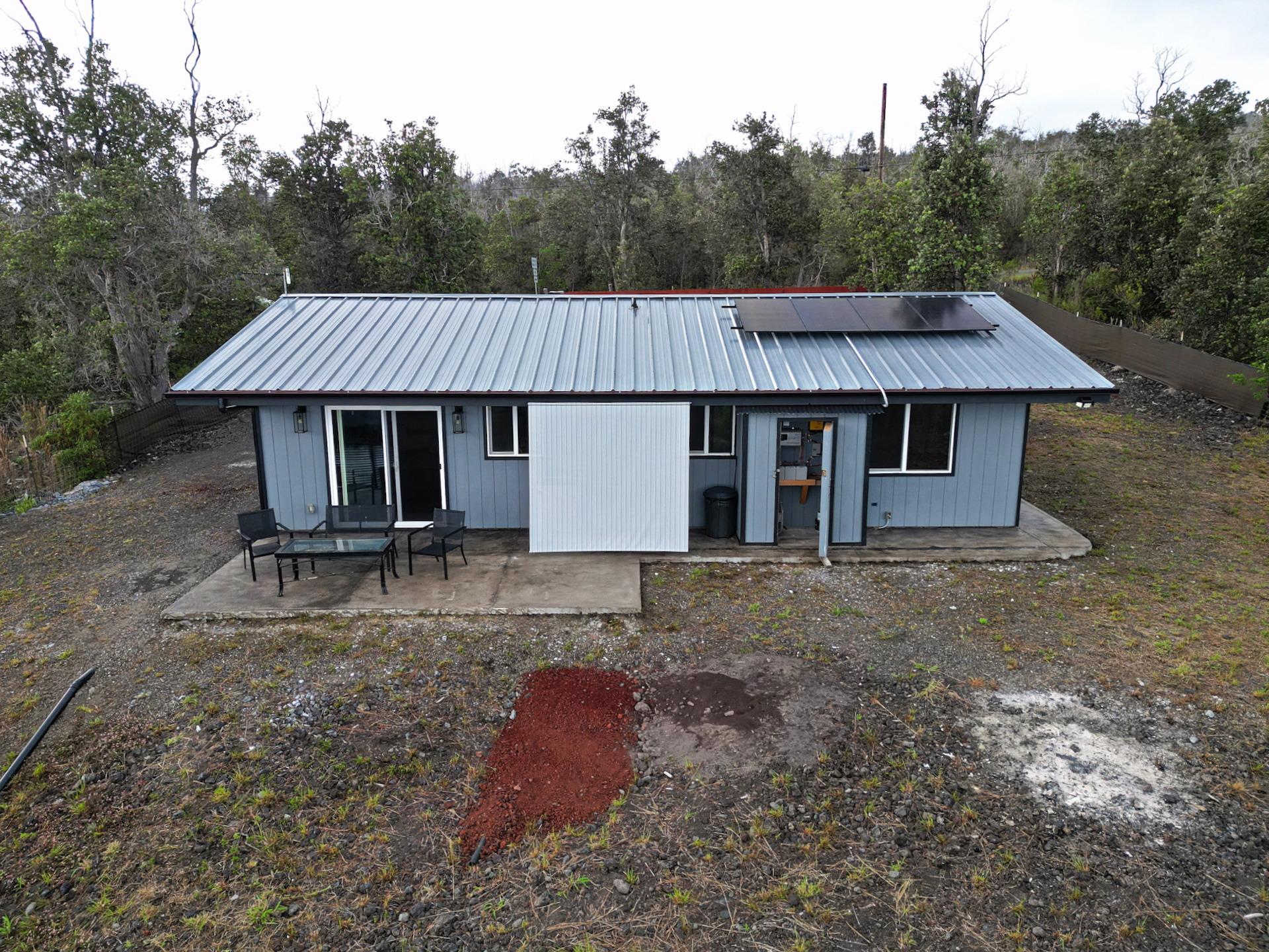 92-1920 Aloha Boulevard Ocean View, HI 96704 - Photo 8 of 26 a view of a house with a yard and roof