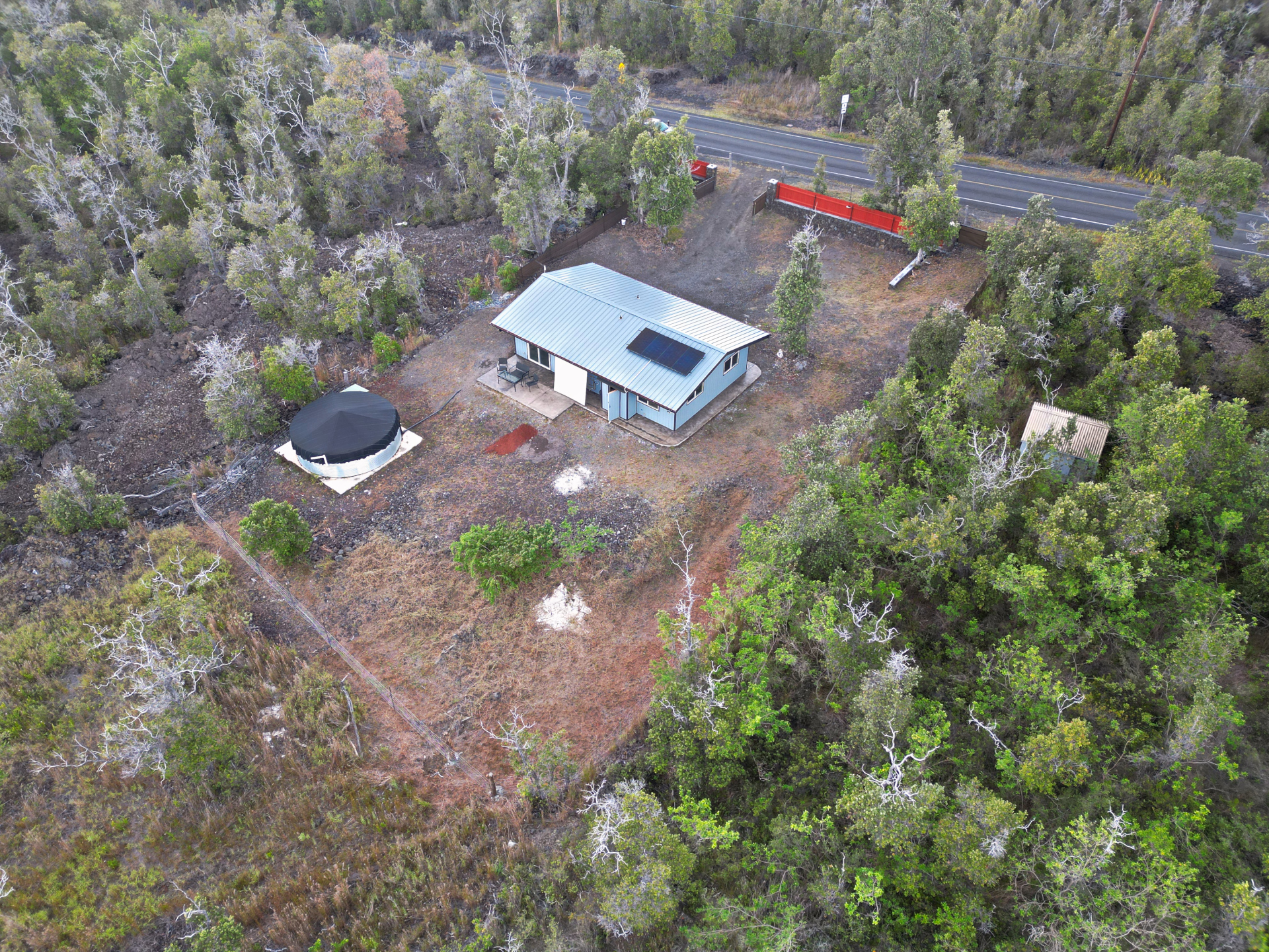 92-1920 Aloha Boulevard Ocean View, HI 96704 - Photo 10 of 26 an aerial view of a house with a yard