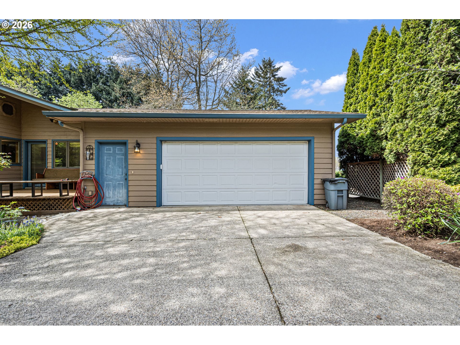 84 Green Lane Eugene, OR 97404 - Photo 6 of 41 a front view of a house with a yard and garage