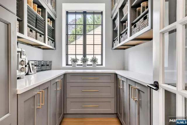 a kitchen with a window and cabinets
