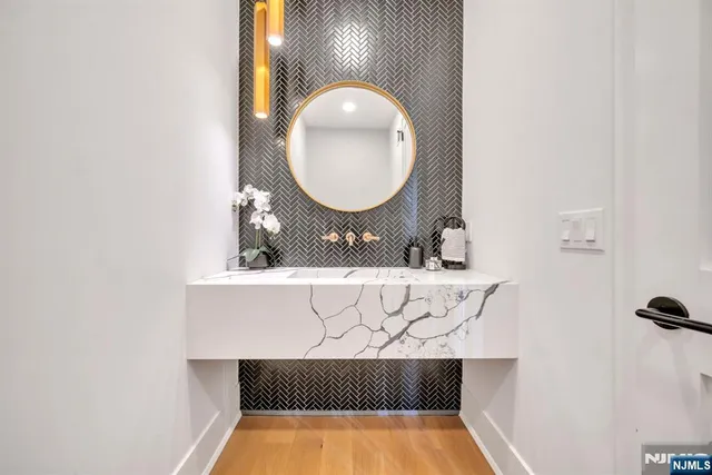 a bathroom with a sink and mirror