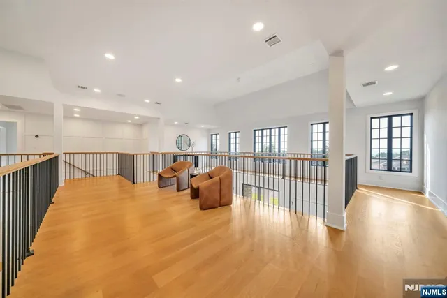 a bed room with furniture and wooden floor