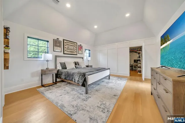 a spacious bedroom with a bed and a couch