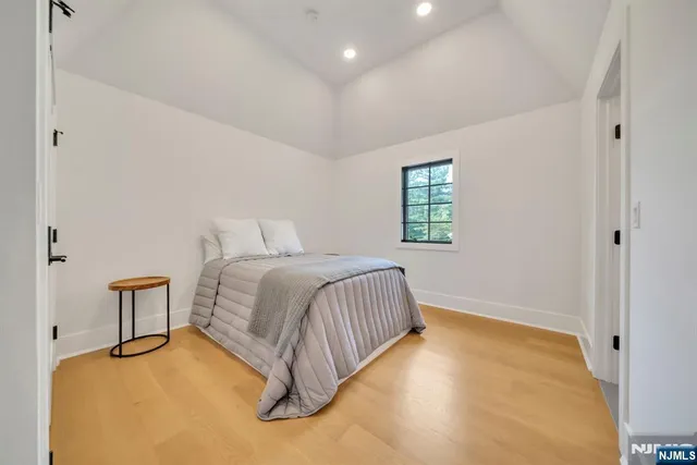 a bedroom with a bed and a table