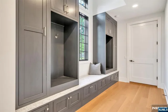 a view of hallway with bathroom