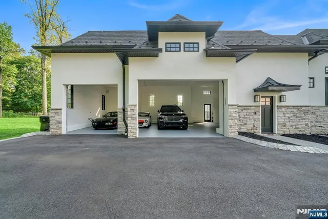a view of a car park in front of a house