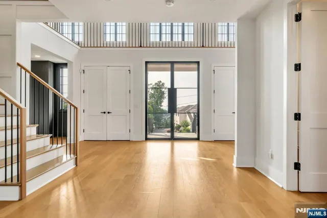 a view of an entryway with wooden floor