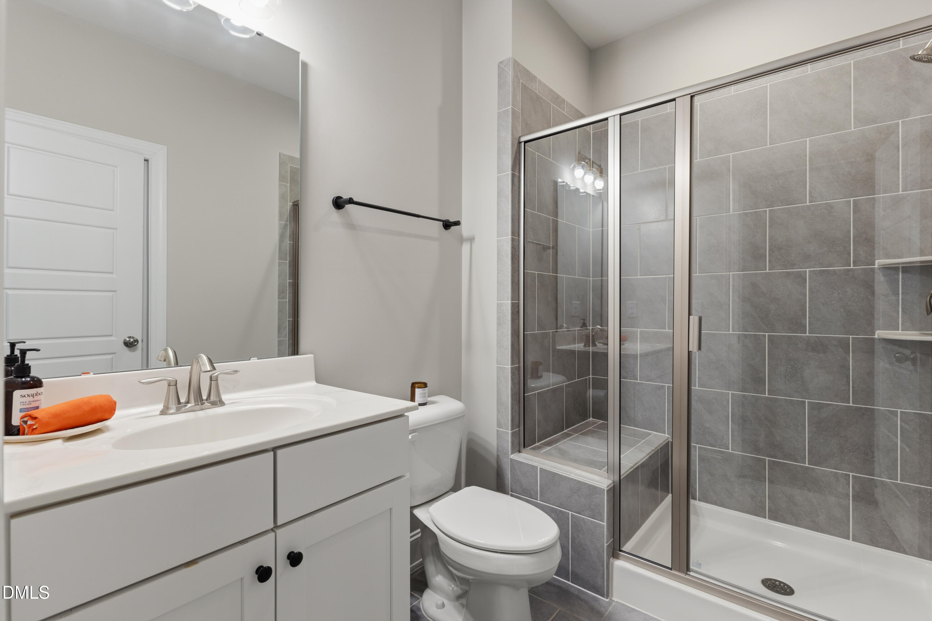7421 Stonehenge Farm Lane Raleigh, NC 27613 - Photo 19 of 48 a bathroom with a sink toilet and shower