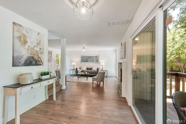 a view of a dining room with furniture window and wooden floor