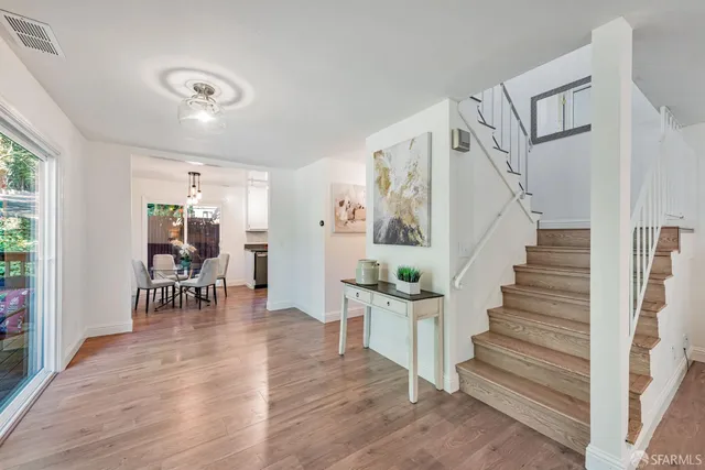 a bed room with a bed and a chandelier
