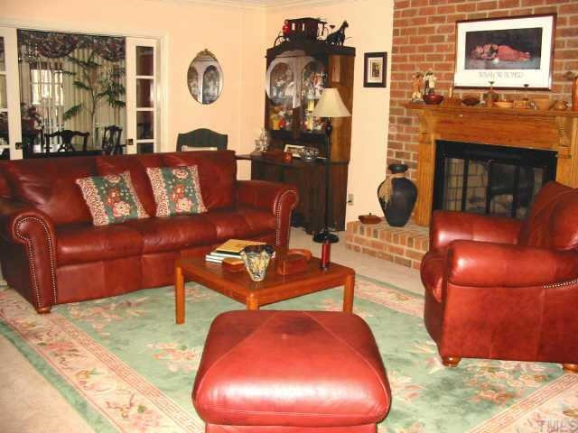 102 Winterberry Ridge Drive Durham, NC 27713 - Photo 2 of 10 Beautiful living room with gas log fireplace, antique mantel, & 'pocket' french doors Other