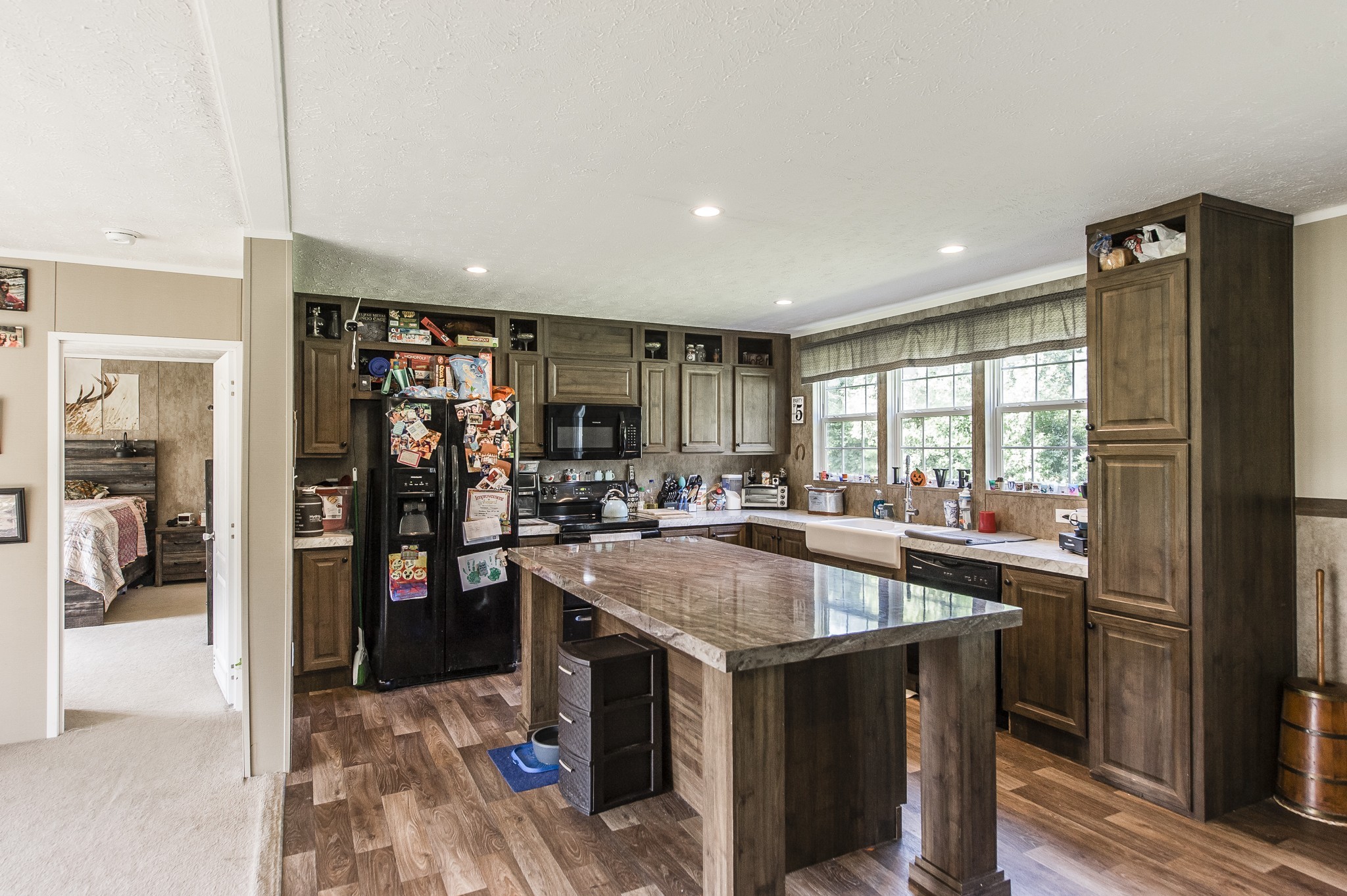 537 Bob Perry Road Bethpage, TN 37022 - Photo 14 of 63 a kitchen with stainless steel appliances granite countertop a refrigerator a sink and a stove