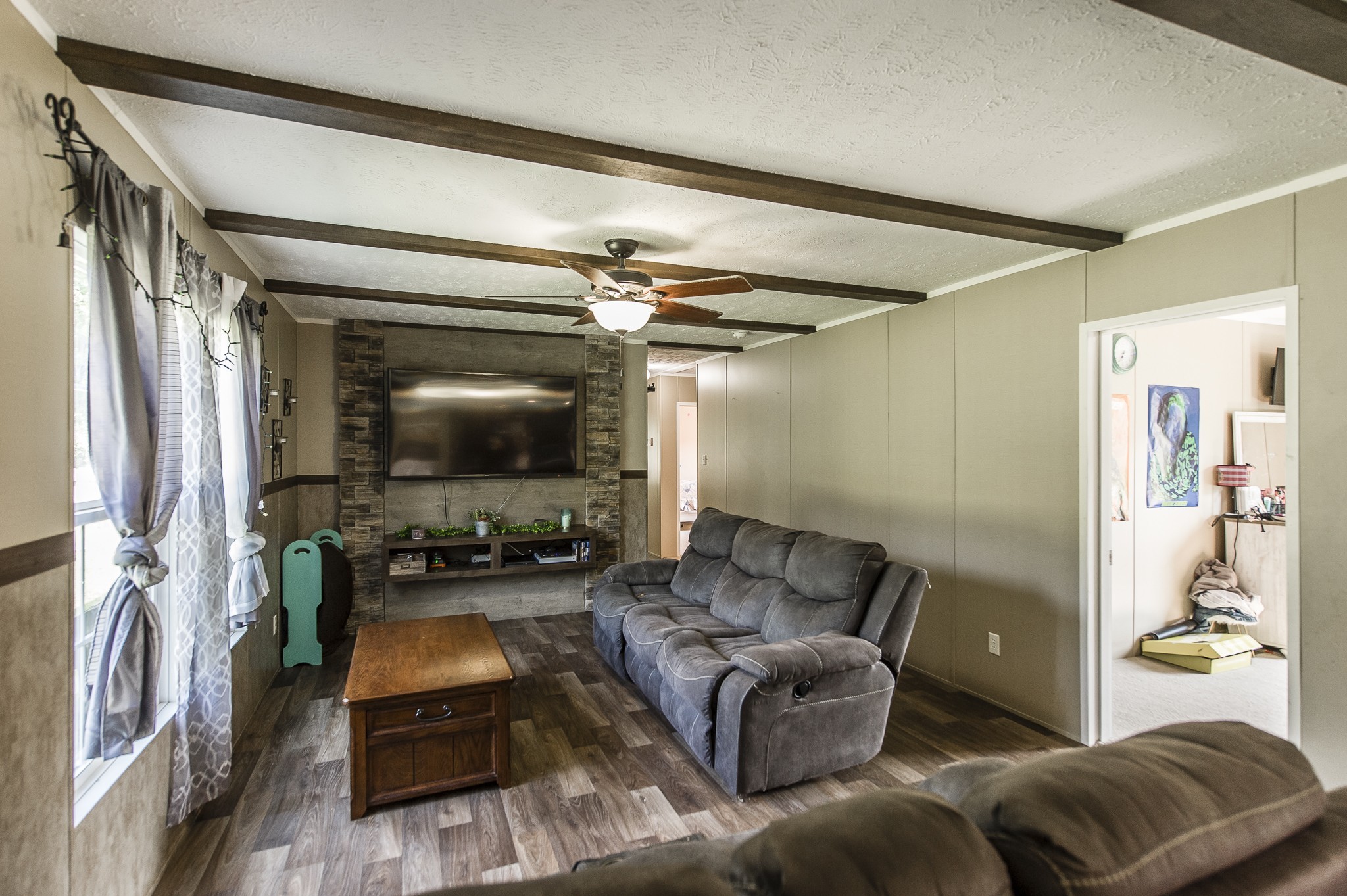 537 Bob Perry Road Bethpage, TN 37022 - Photo 24 of 63 a living room with furniture and a flat screen tv