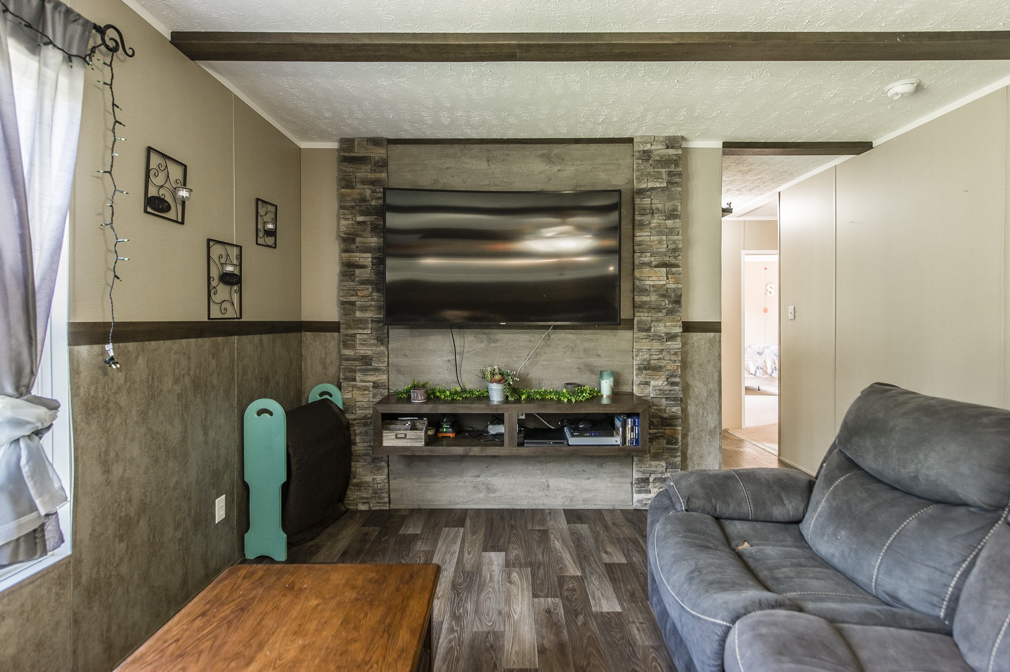 537 Bob Perry Road Bethpage, TN 37022 - Photo 28 of 63 a living room with furniture and a flat screen tv
