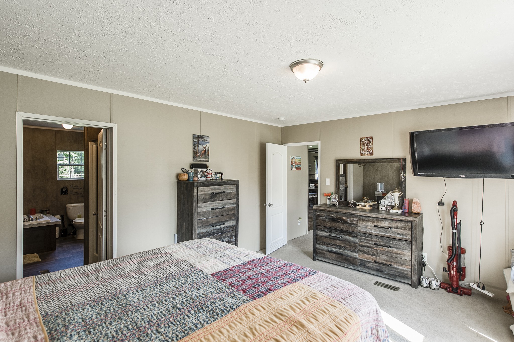 537 Bob Perry Road Bethpage, TN 37022 - Photo 31 of 63 a bedroom with a bed and a flat screen tv