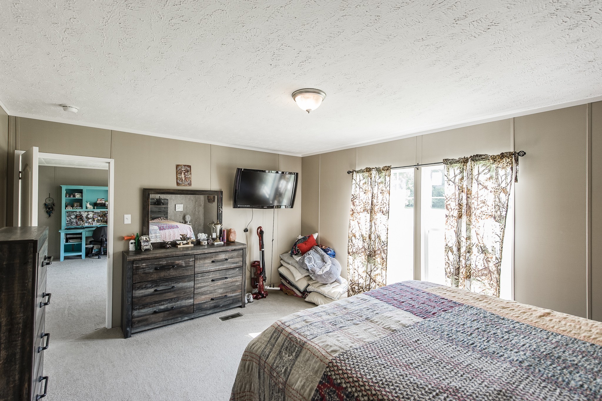 537 Bob Perry Road Bethpage, TN 37022 - Photo 32 of 63 a bedroom with furniture and a flat screen tv