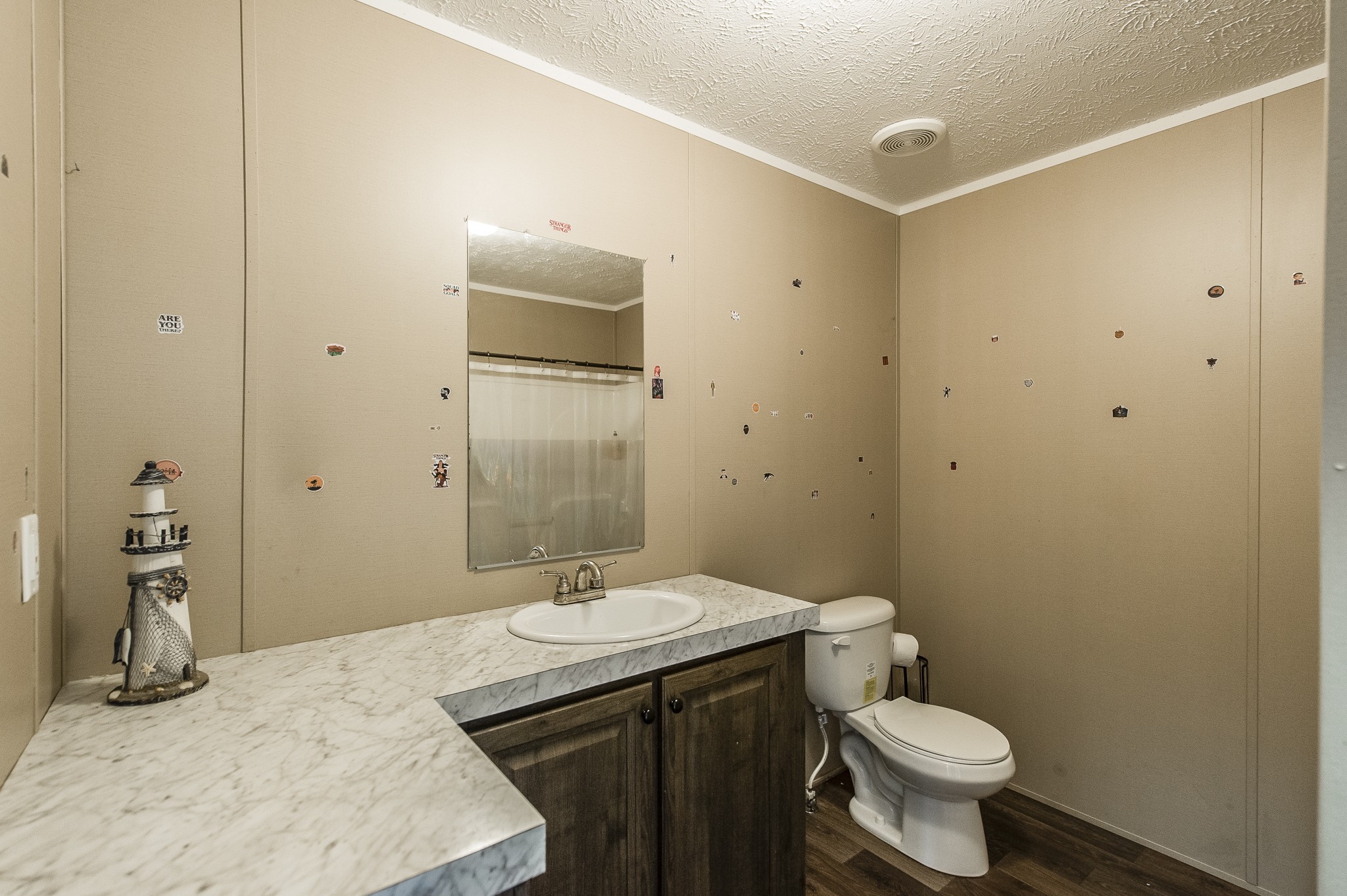 537 Bob Perry Road Bethpage, TN 37022 - Photo 45 of 63 a bathroom with a granite countertop sink toilet and shower