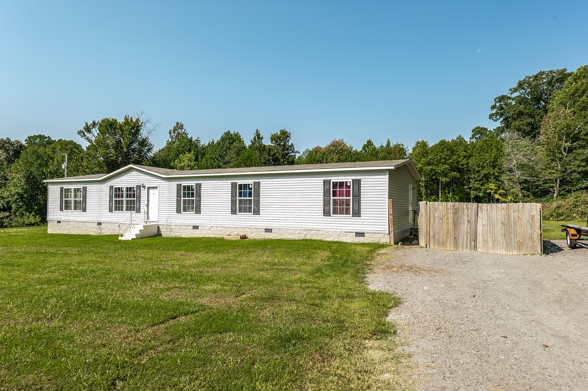 537 Bob Perry Road Bethpage, TN 37022 - Photo 7 of 63 a view of a yard in front of a house with plants and large tree