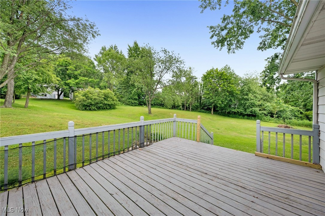 7923 Zigler Road Sterling, OH 44276 - Photo 27 of 31 Wooden terrace with a yard and view of wooded area