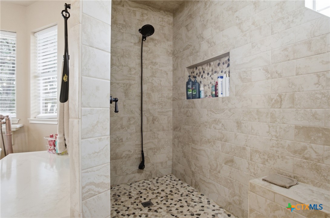 642 Phantom Rider Trail Spring Branch, TX 78070 - Photo 18 of 41 a bathroom with a shower