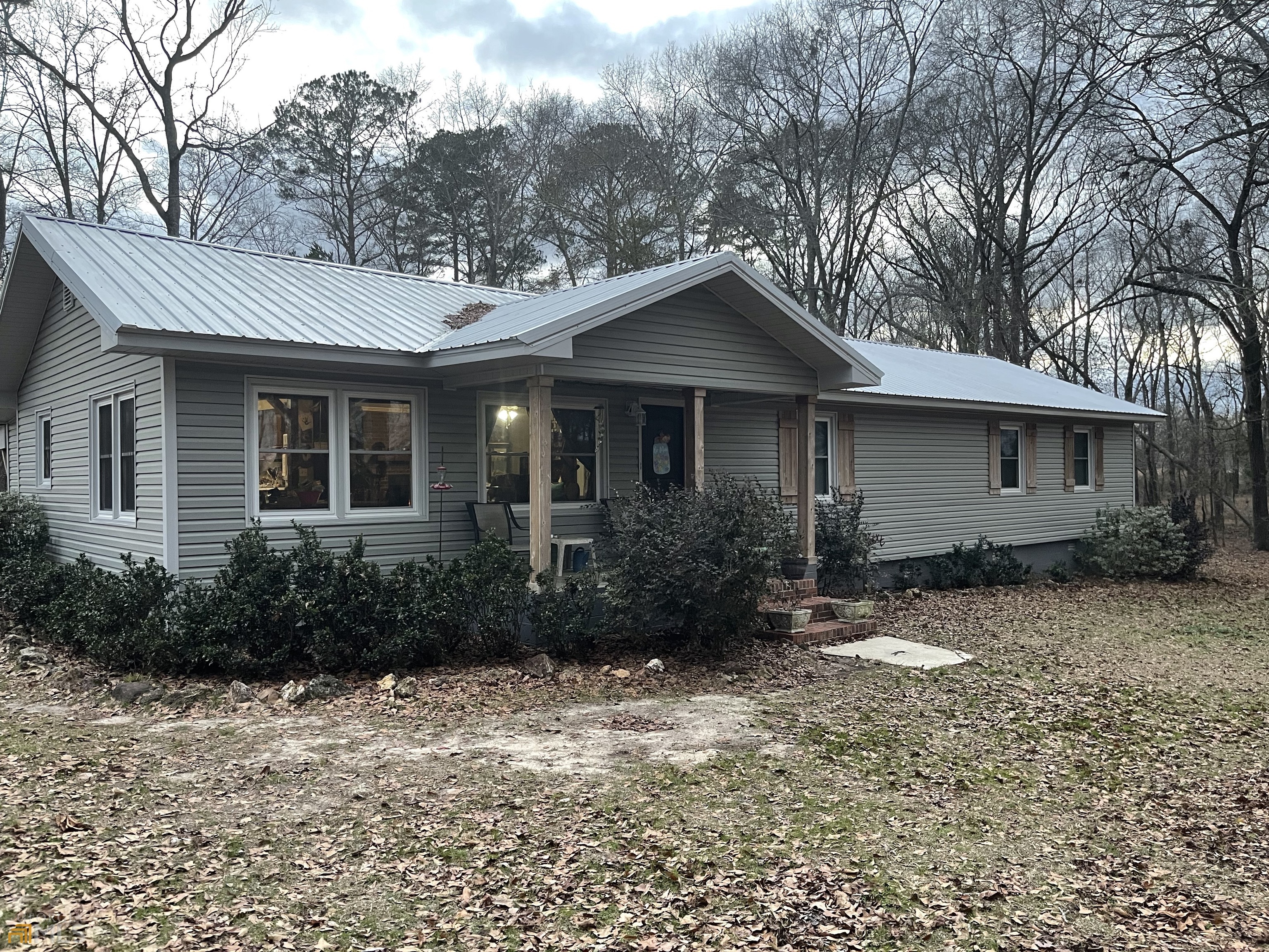 229 Terrell Road Elko, GA 31025 - Photo 1 of 1 a front view of house with yard and trees around