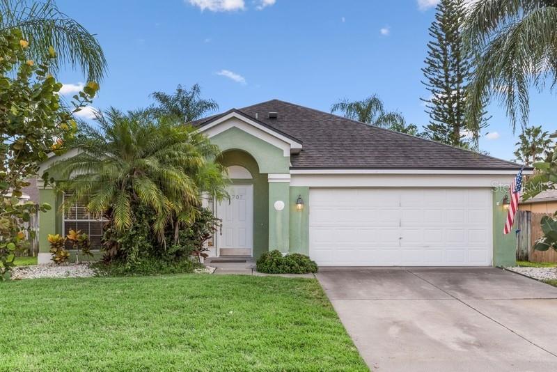 1707 Canoe Creek Road Oviedo, FL 32766 - Photo 1 of 1 a front view of a house with garden
