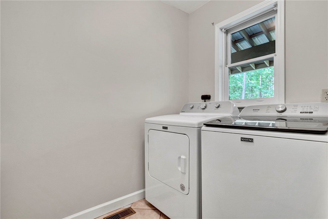 120 Patterson Ridge Road Salem, SC 29676 - Photo 18 of 46 Functional laundry space featuring modern appliances and a well-lit window overlooking back porch.
