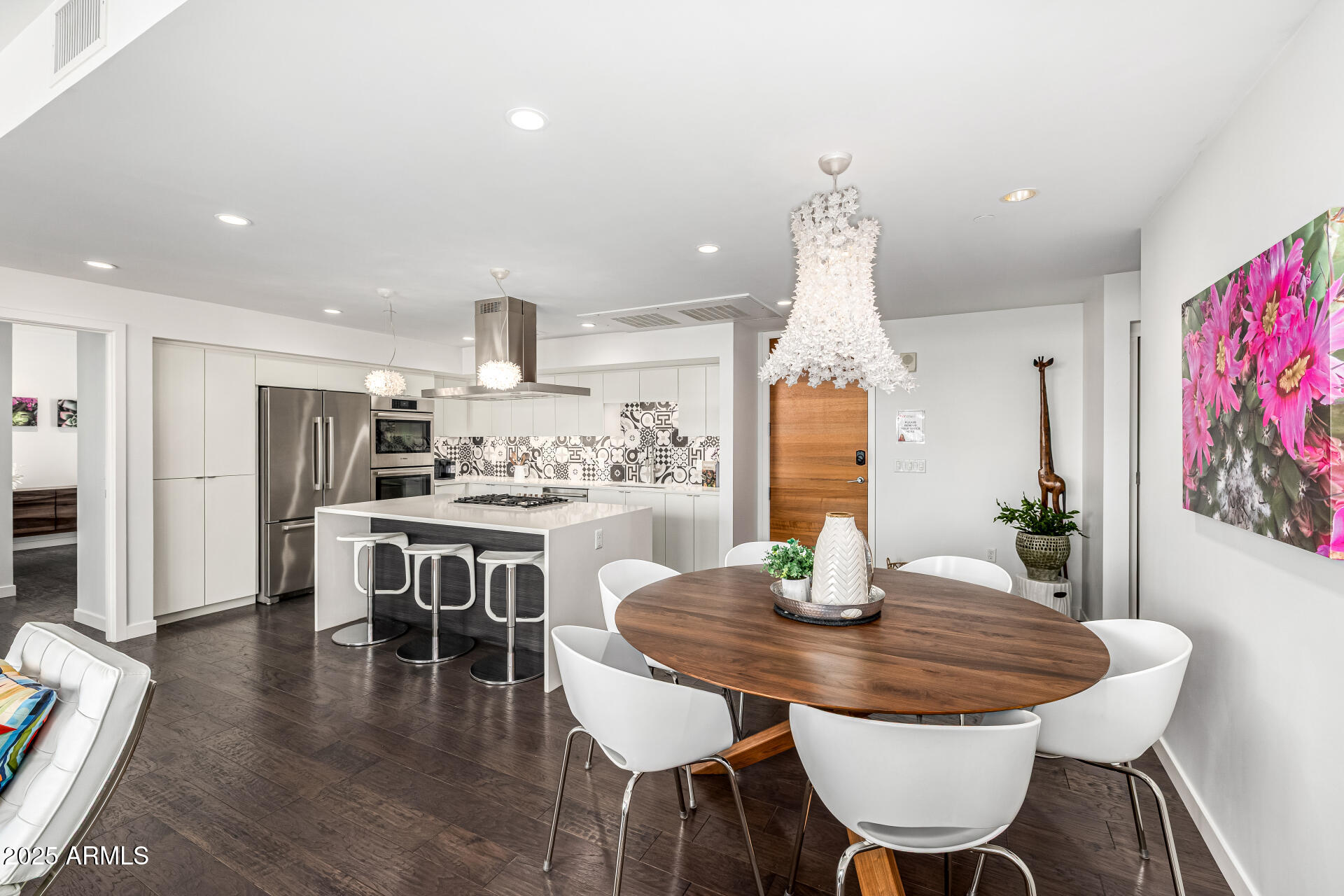 200 West Portland Street, Unit 827 Phoenix, AZ 85003 - Photo 9 of 111 a kitchen with a dining table and chairs