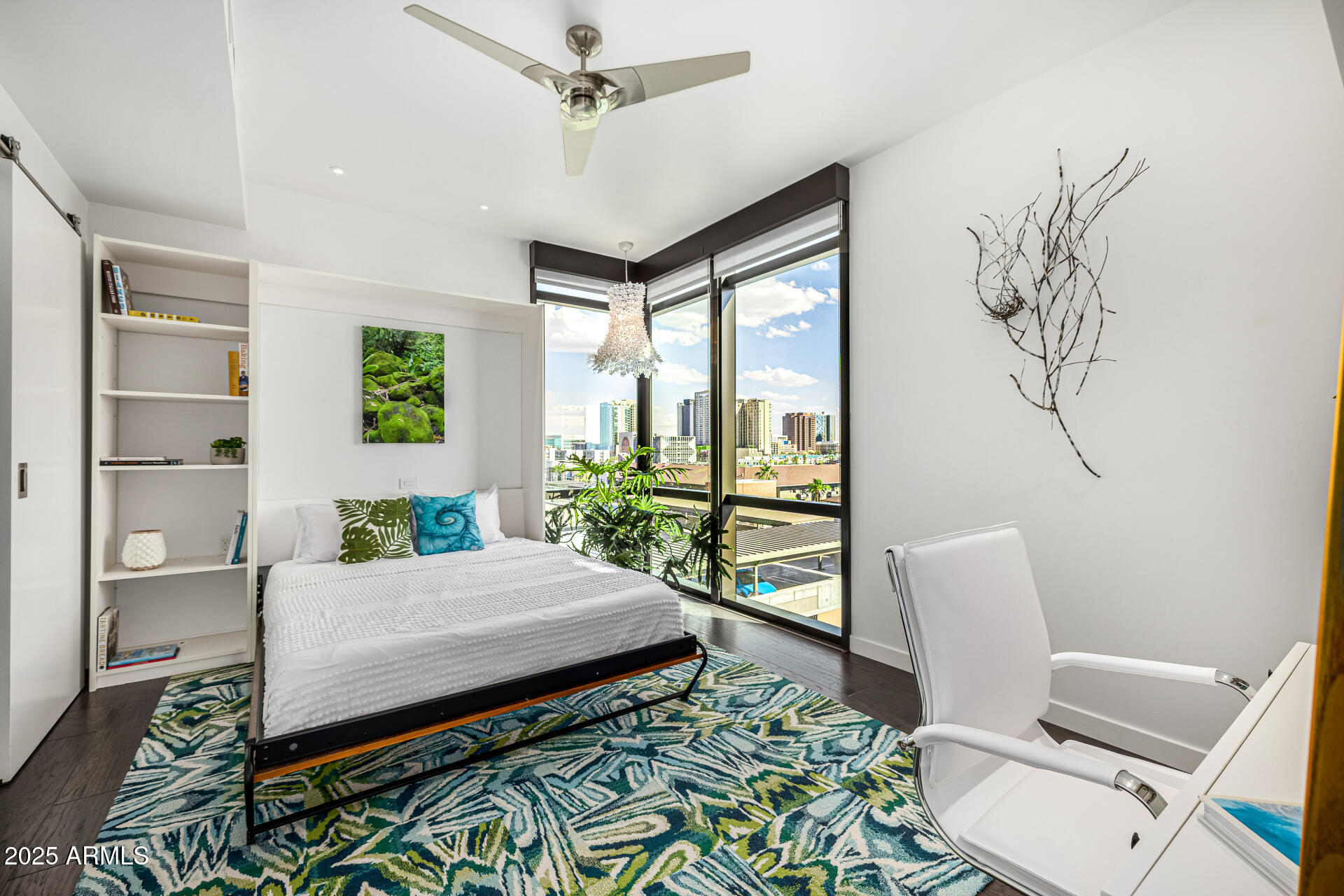 200 West Portland Street, Unit 827 Phoenix, AZ 85003 - Photo 12 of 111 a living room with a bed furniture and a potted plant