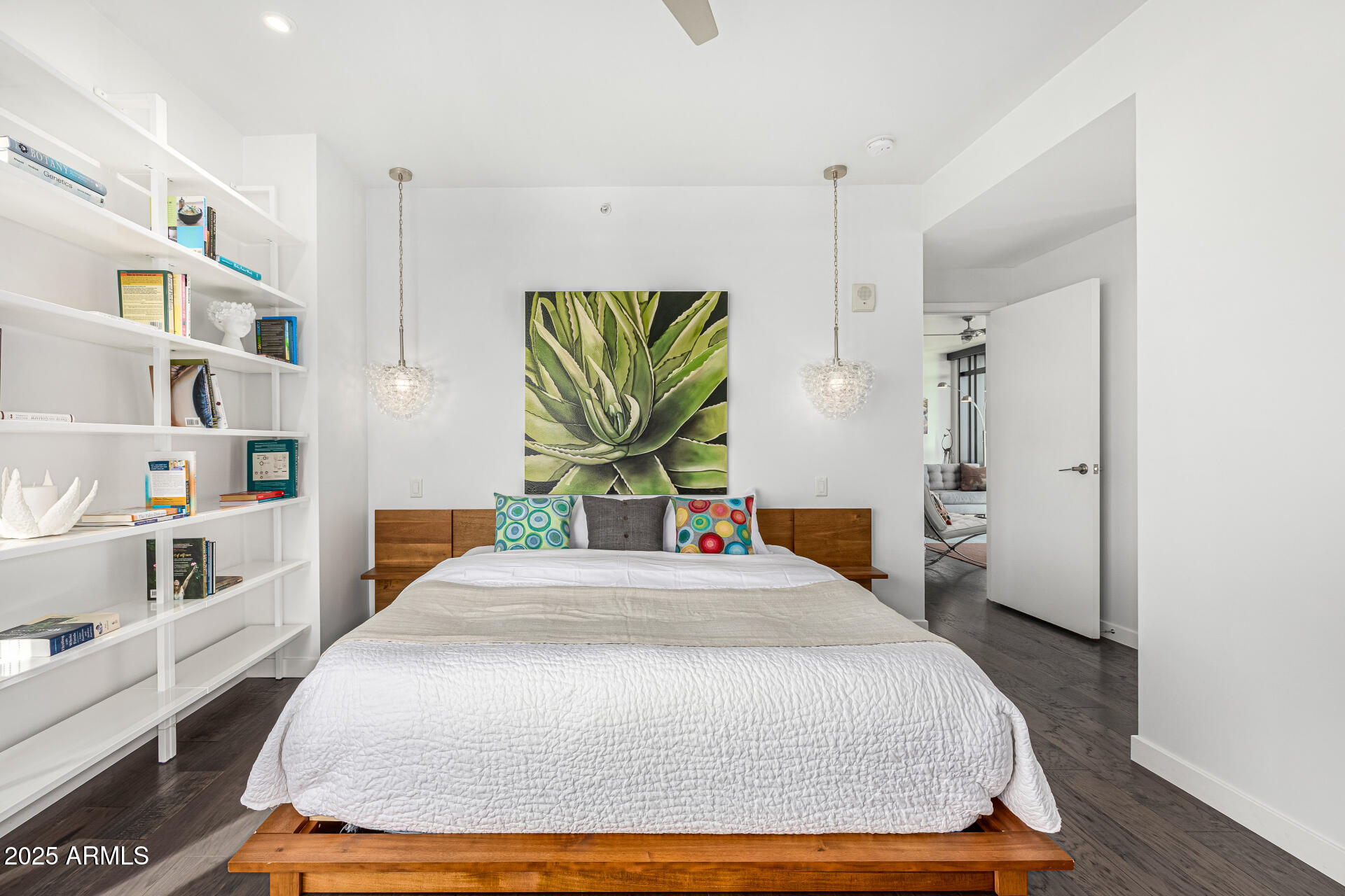 200 West Portland Street, Unit 827 Phoenix, AZ 85003 - Photo 20 of 111 a bedroom with a large bed and a book shelf
