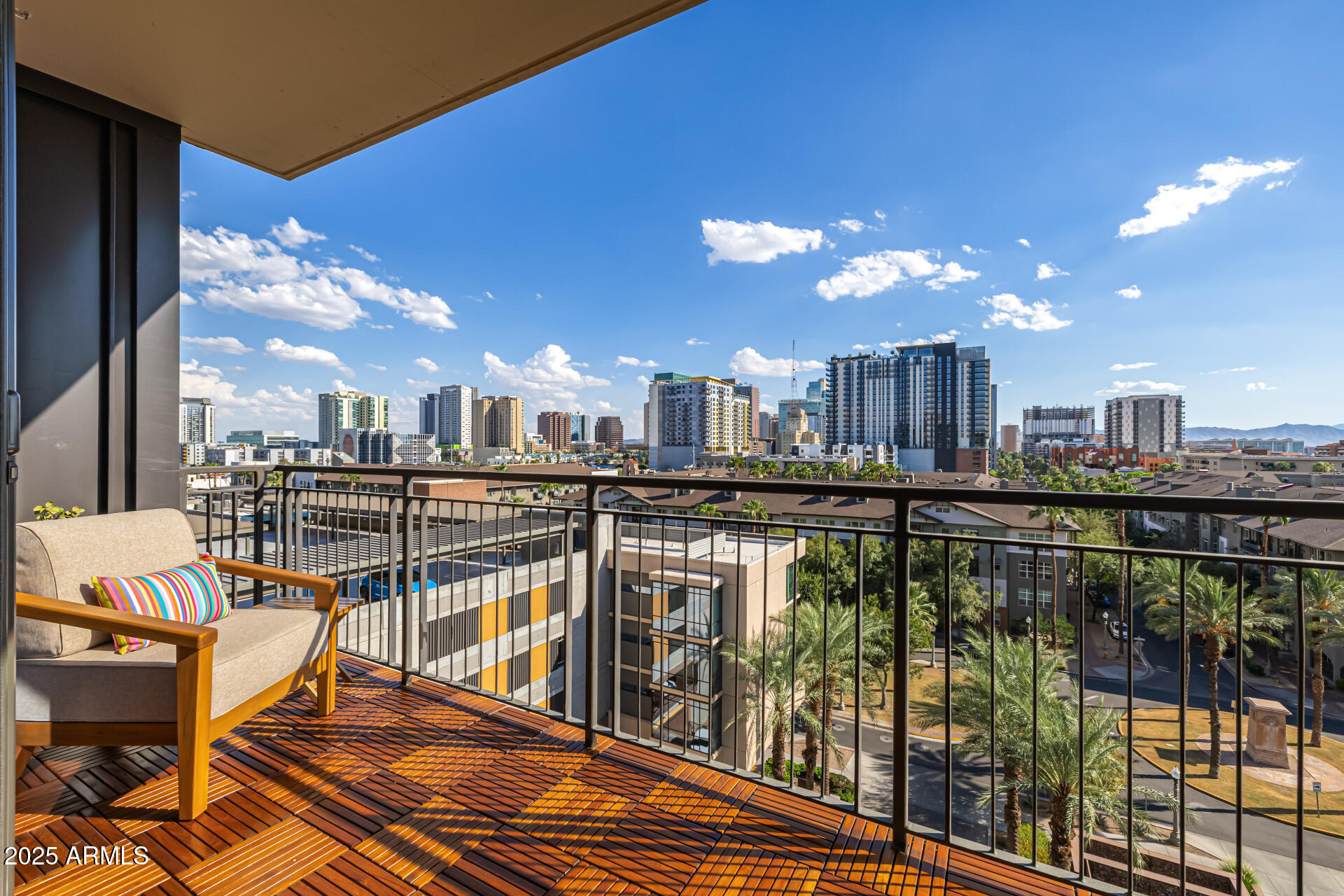 200 West Portland Street, Unit 827 Phoenix, AZ 85003 - Photo 28 of 111 a view of a balcony with dining table & chairs