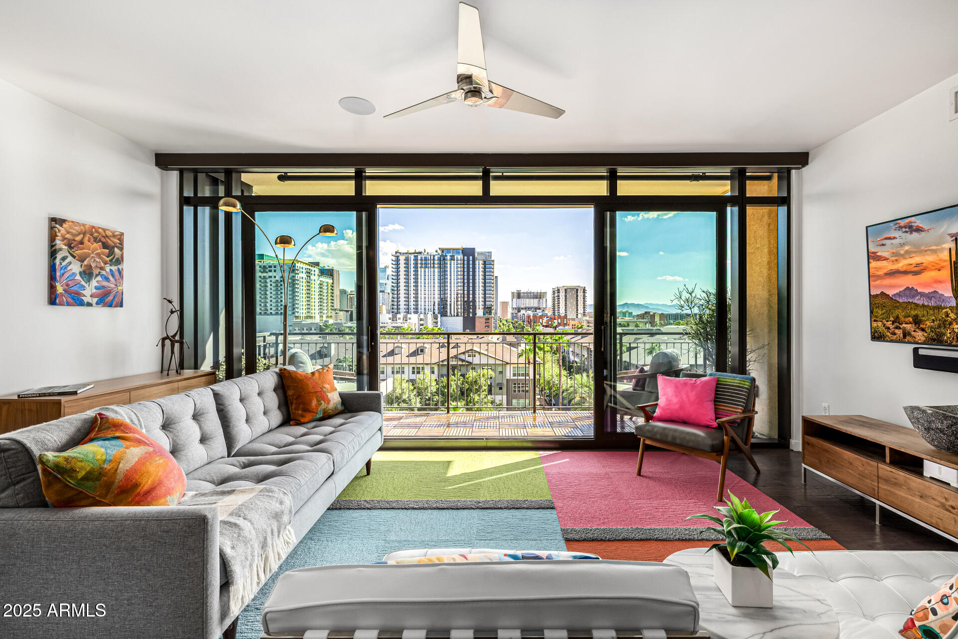 200 West Portland Street, Unit 827 Phoenix, AZ 85003 - Photo 2 of 111 a living room with furniture and a floor to ceiling window