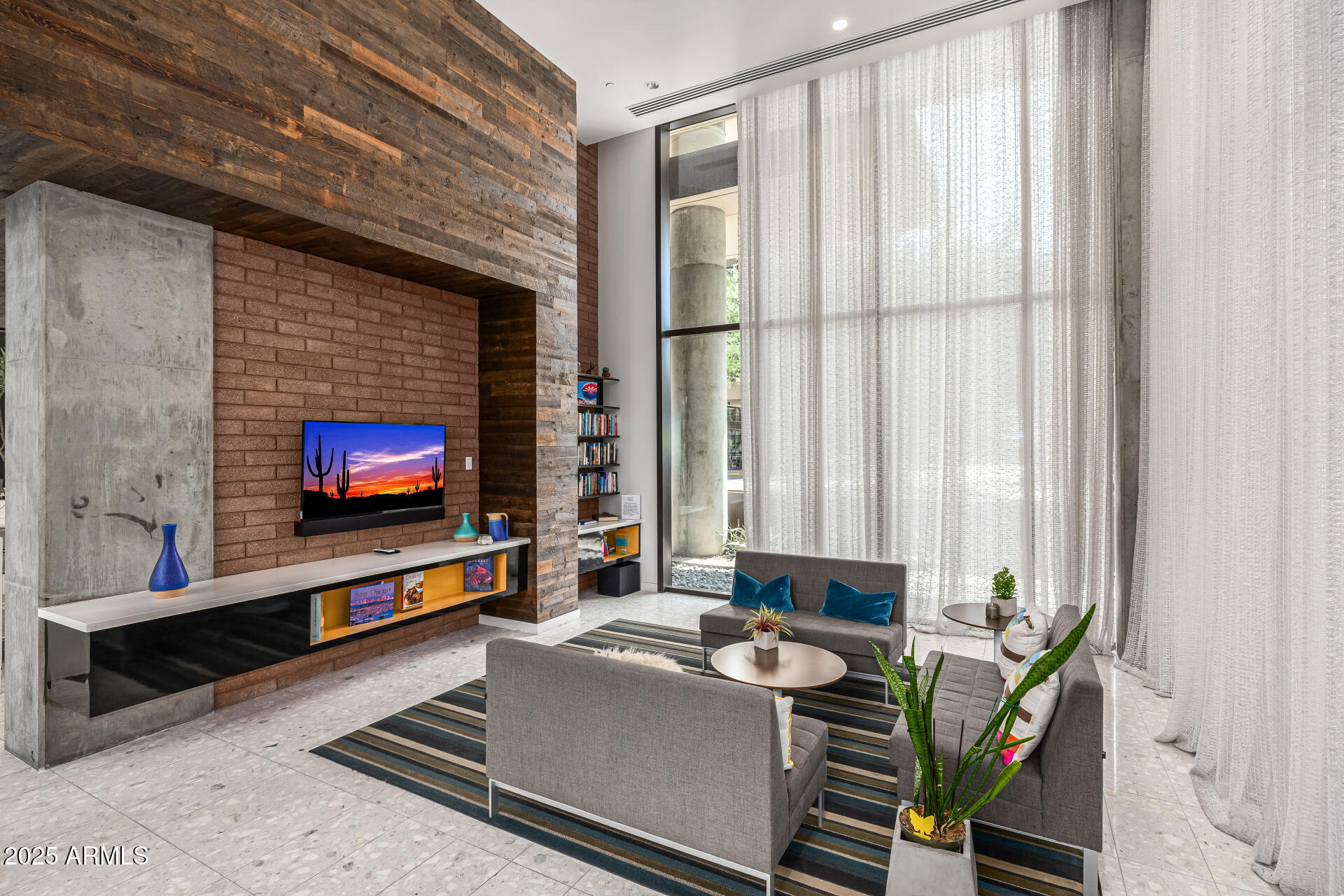 200 West Portland Street, Unit 827 Phoenix, AZ 85003 - Photo 32 of 111 a living room with furniture and a flat screen tv
