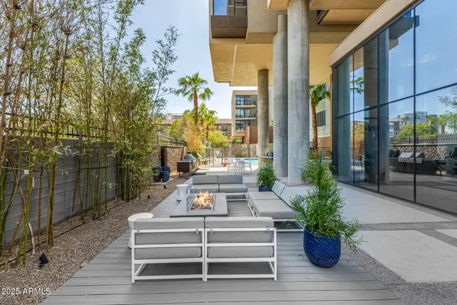 a view of a city with lots of residential buildings ocean and mountain view in back