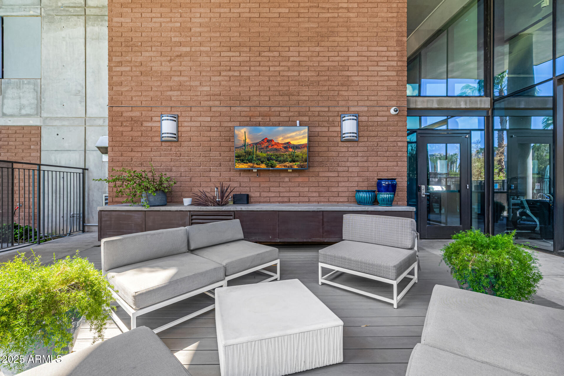 200 West Portland Street, Unit 827 Phoenix, AZ 85003 - Photo 54 of 111 a view of a patio with couches table and chairs with potted plants