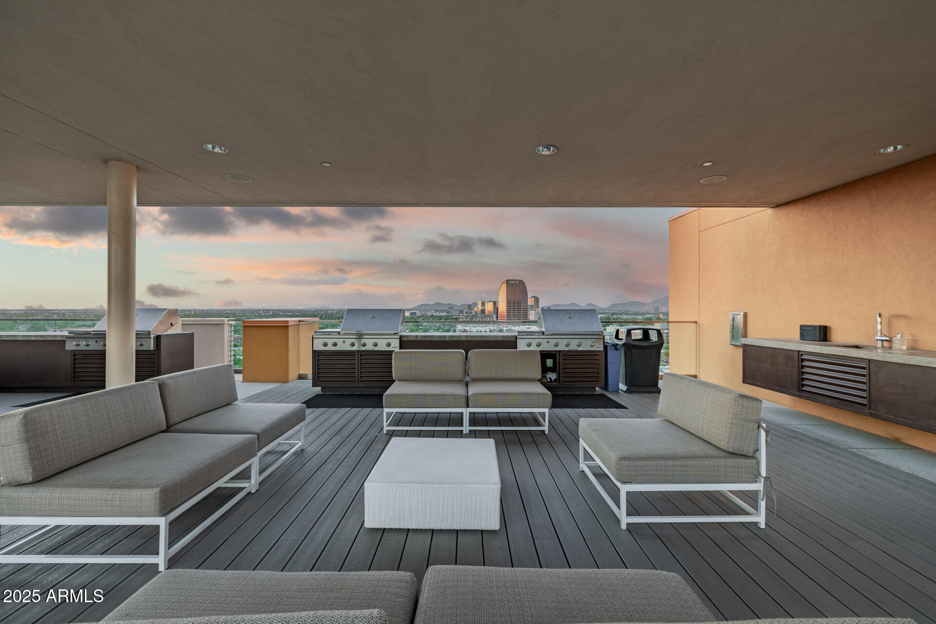 200 West Portland Street, Unit 827 Phoenix, AZ 85003 - Photo 87 of 111 an outdoor living room with patio furniture and a floor to ceiling window
