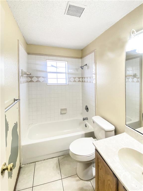 483 Whalen Road San Benito, TX 78586 - Photo 4 of 10 a bathroom with a granite countertop sink toilet a mirror and bathtub