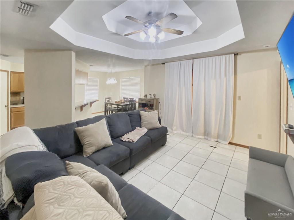 483 Whalen Road San Benito, TX 78586 - Photo 5 of 10 a living room with furniture and a chandelier
