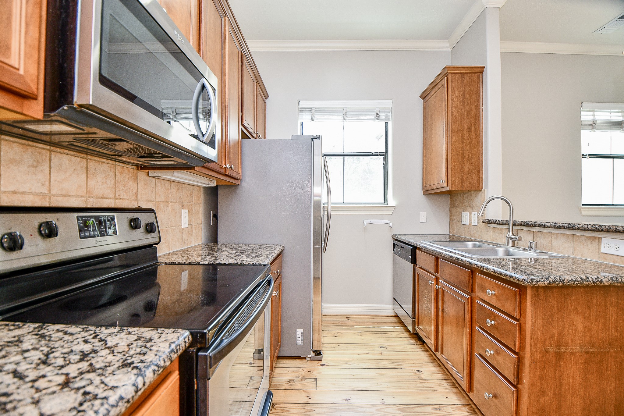 118 McGowen Street, Unit K Houston, TX 77006 - Photo 13 of 32 Open concept style kitchen ample cabinet space pantry granite counters and lots of natural light