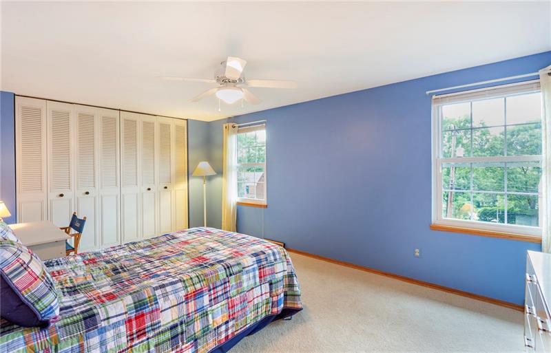 8284 Post Road Allison Park, PA 15101 - Photo 17 of 23 Bedroom 2 is very spacious measuring 17'x11'. The room is filled with sunshine and offers a large closet.