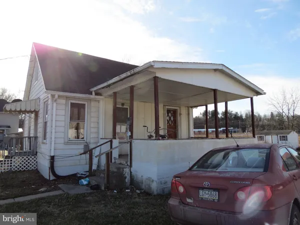 a view of a car parked in front of a house