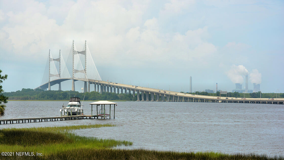 906 Rotary Road Jacksonville, FL 32211 - Photo 17 of 20 a view of a lake with a bridge and a bridge